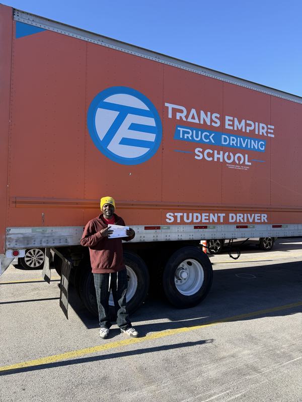 Trans Empire Truck Driving School graduate with their certificate