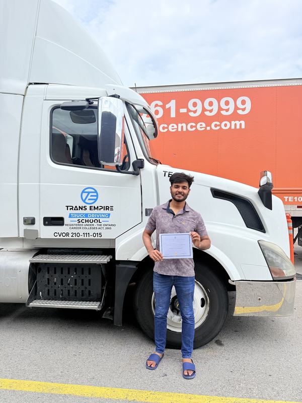 Trans Empire Truck Driving School graduate with their certificate